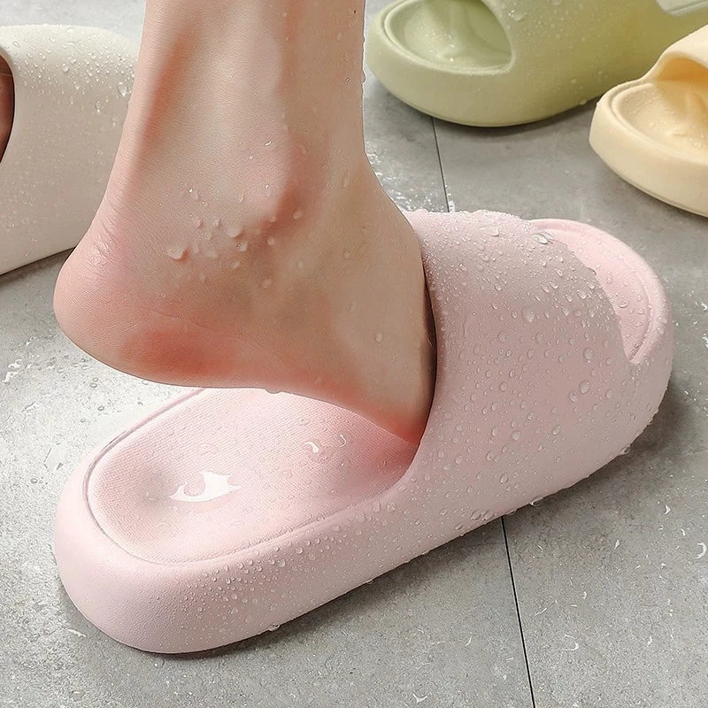 Water beading on the thick foam of a pink cloud slide.