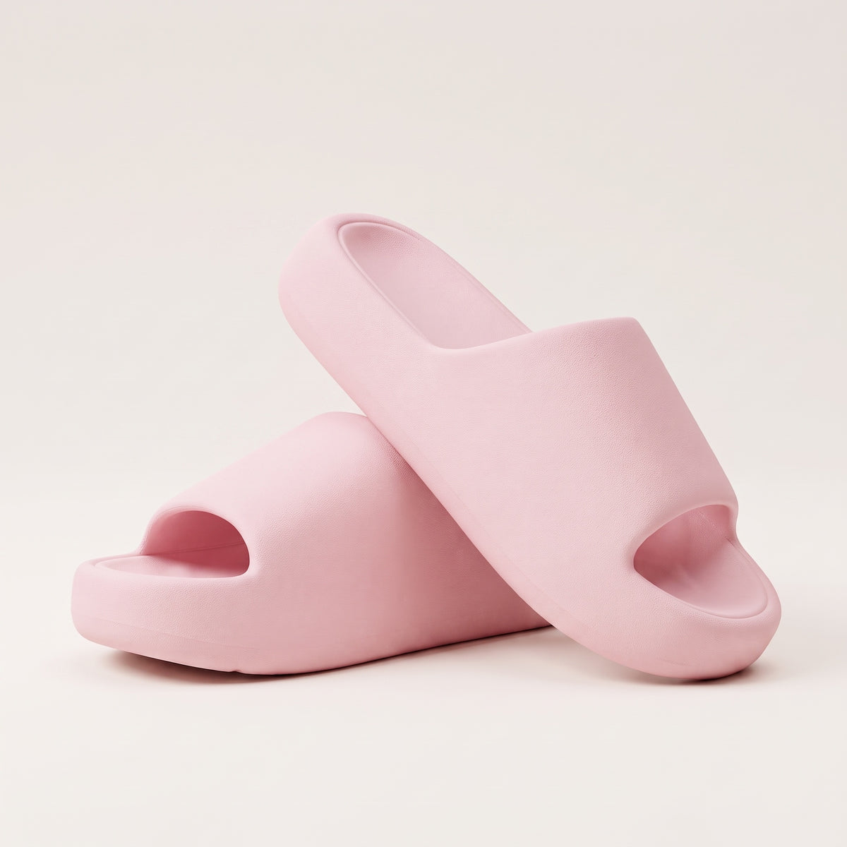 30SNKRS Thick Platform Cloud Slides in pink, pair shown on a cream studio background