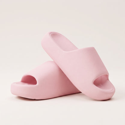 30SNKRS Thick Platform Cloud Slides in pink, pair shown on a cream studio background