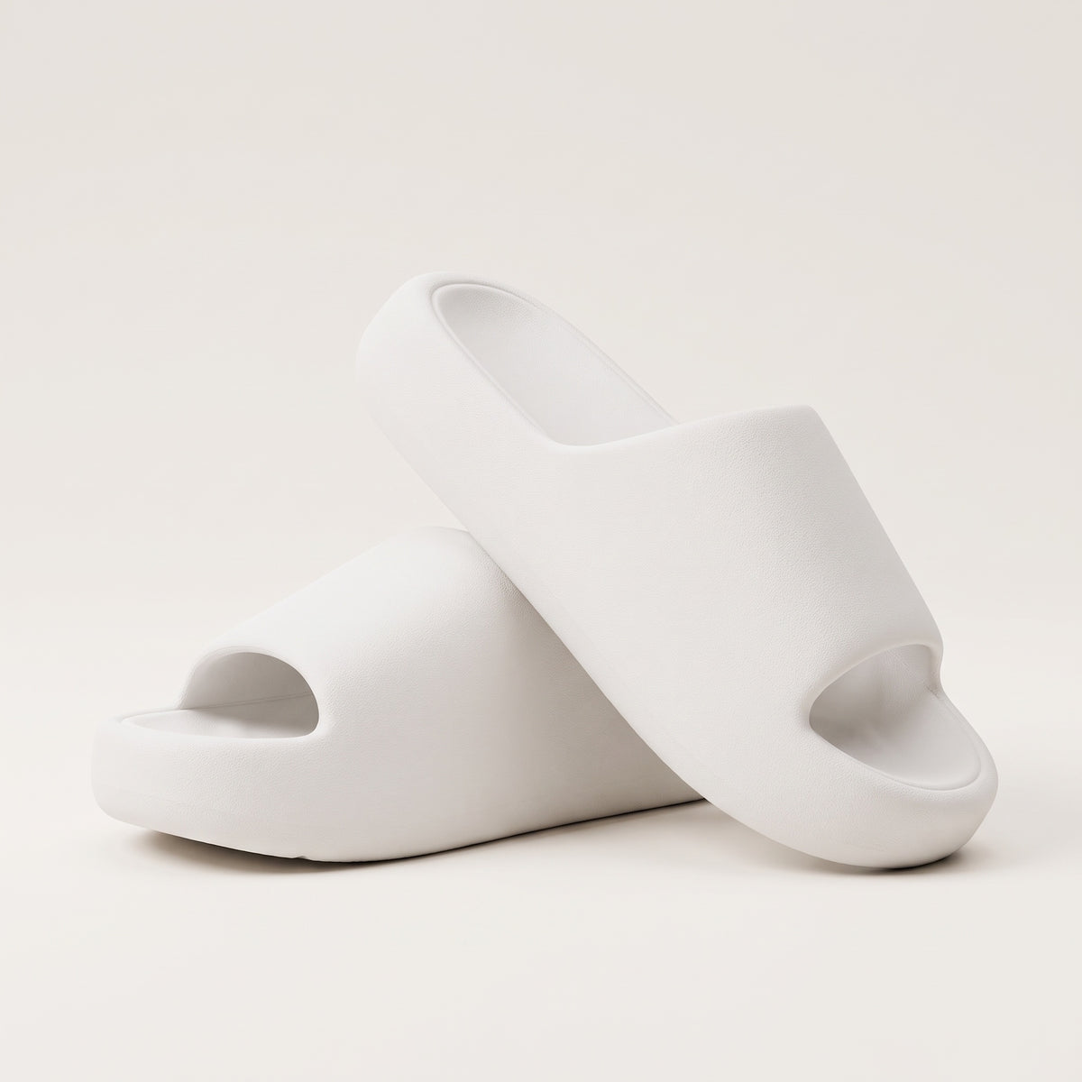 30SNKRS Thick Platform Cloud Slides in white, pair shown on a cream studio background with thick moulded EVA foam sole