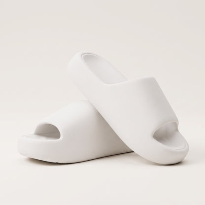 30SNKRS Thick Platform Cloud Slides in white, pair shown on a cream studio background with thick moulded EVA foam sole