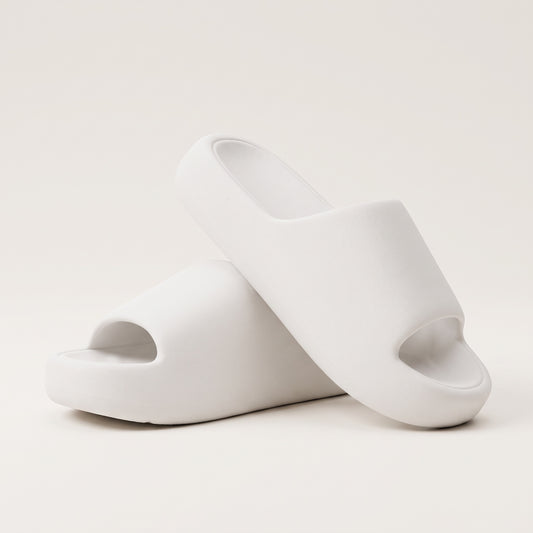 30SNKRS Thick Platform Cloud Slides in white, pair shown on a cream studio background with thick moulded EVA foam sole