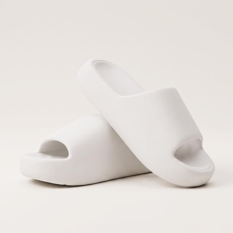 30SNKRS Thick Platform Cloud Slides in white, pair shown on a cream studio background with thick moulded EVA foam sole