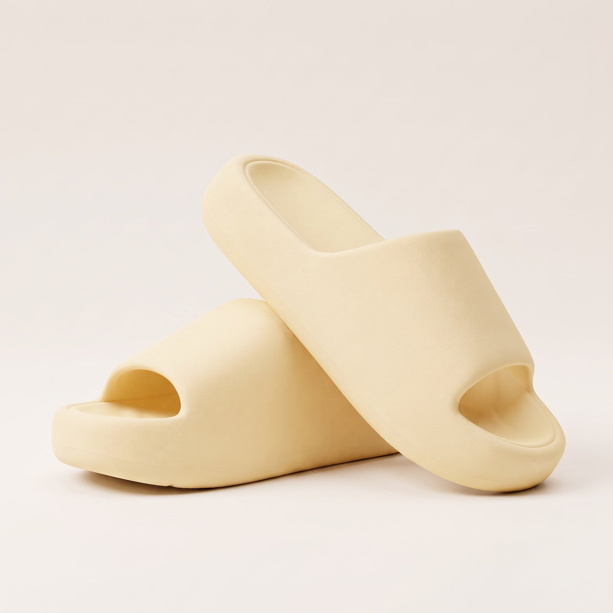30SNKRS Thick Platform Cloud Slides in yellow, pair shown on a cream studio background
