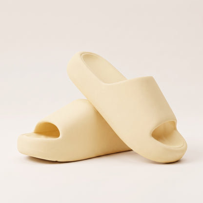 30SNKRS Thick Platform Cloud Slides in yellow, pair shown on a cream studio background